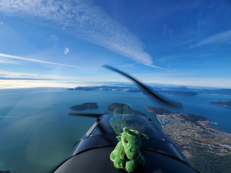 Photo of islands in the
distance, and Norbert the dragon in the bottom of the frame