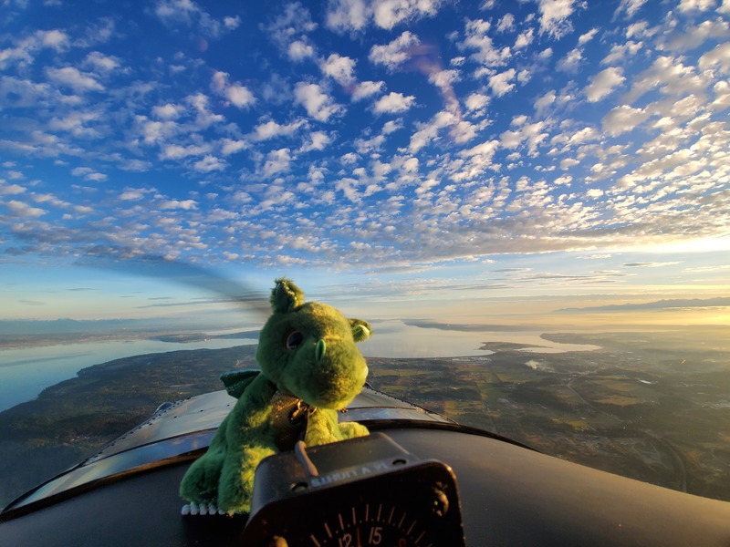 Photo of Norbert in front of a
deep blue sky with puffy clouds